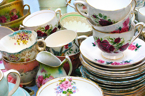 Antique tea cups and saucers as table settings and wedding favors