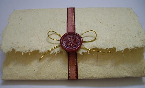 Invitations and menus printed on handmade paper give a beautiful rustic 